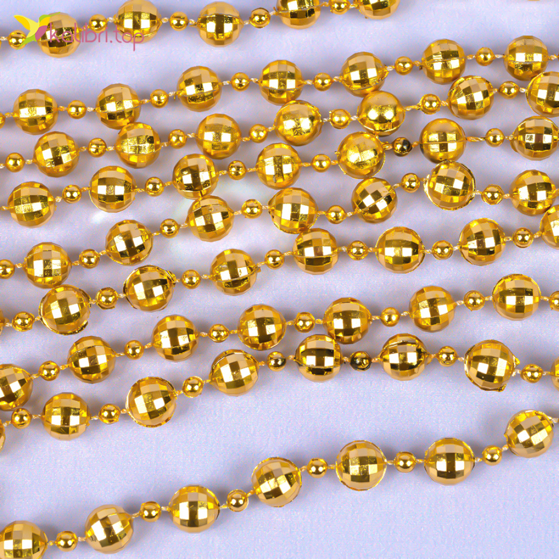 Новорічний декор намисто золотий блиск 2,7 метра, 10 штук оптом фото 02 Новорічний декор намисто золотий блиск 2,7 метра, 10 штук оптом фото 02