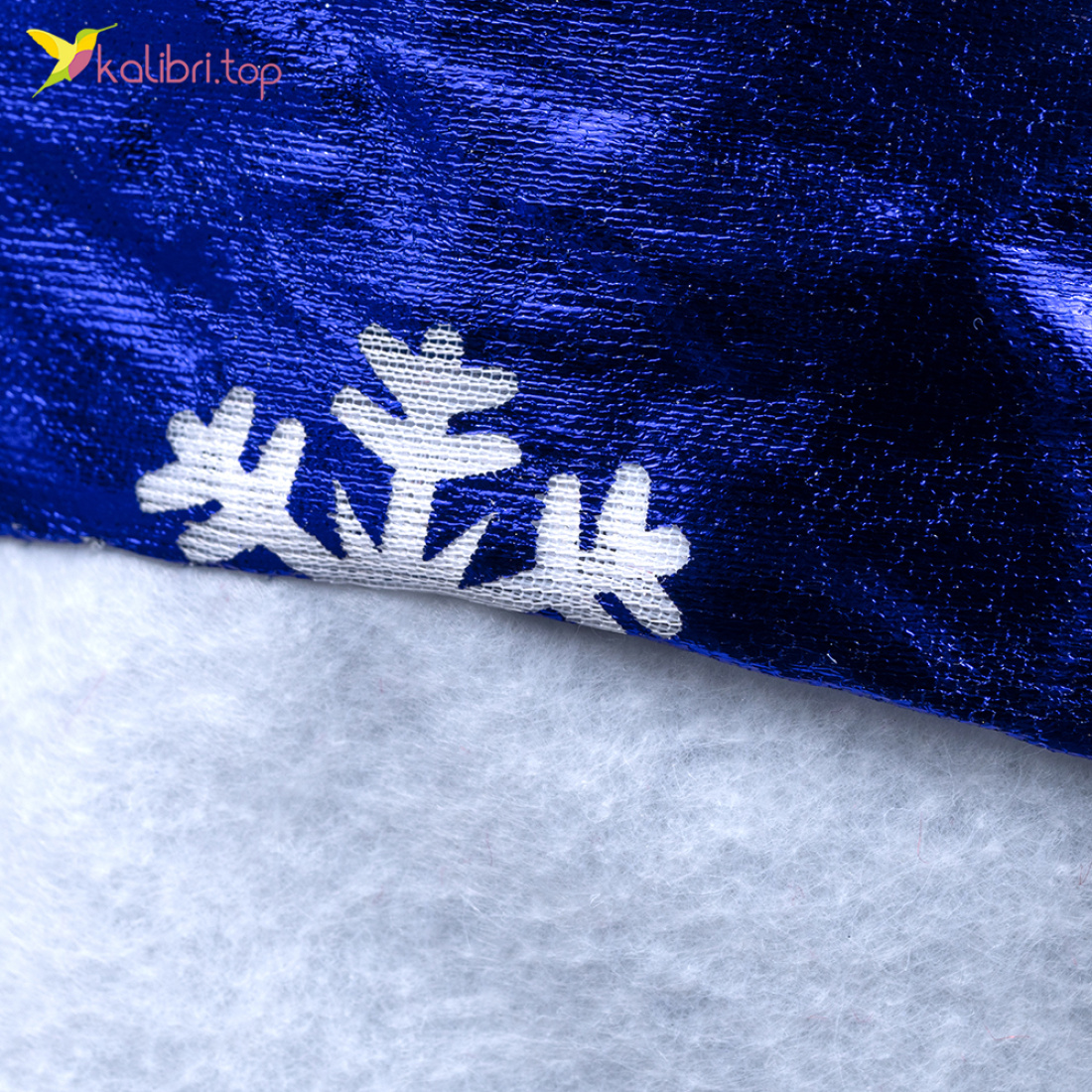 Новорічна шапка синя зі сніжинкою білою 38 см оптом фото 02 Новорічна шапка синя зі сніжинкою білою 38 см оптом фото 02