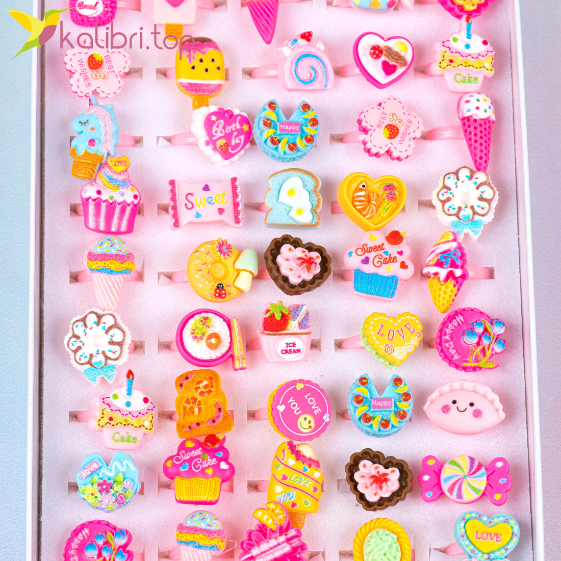 Дитячі каблучки на палець Солодощі 50 штук оптом фото 01