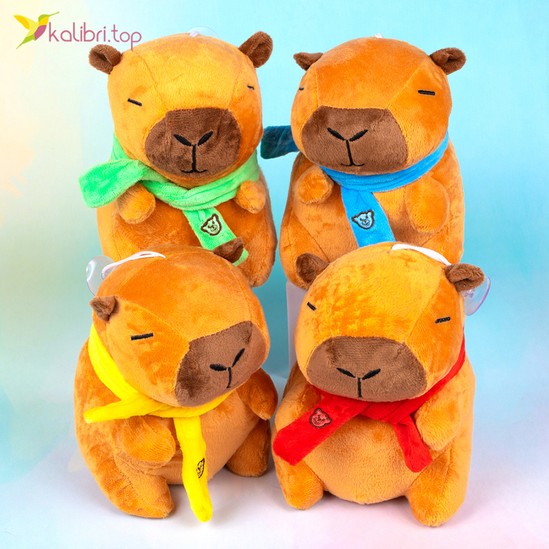 Мягкие игрушки Капибары в шарфиках 16 см оптом фото 01 Мягкие игрушки Капибары в шарфиках 16 см оптом фото 01